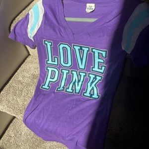 PINK Victoria’s Secret purple t-shirt, with blue patches and striped sleeves